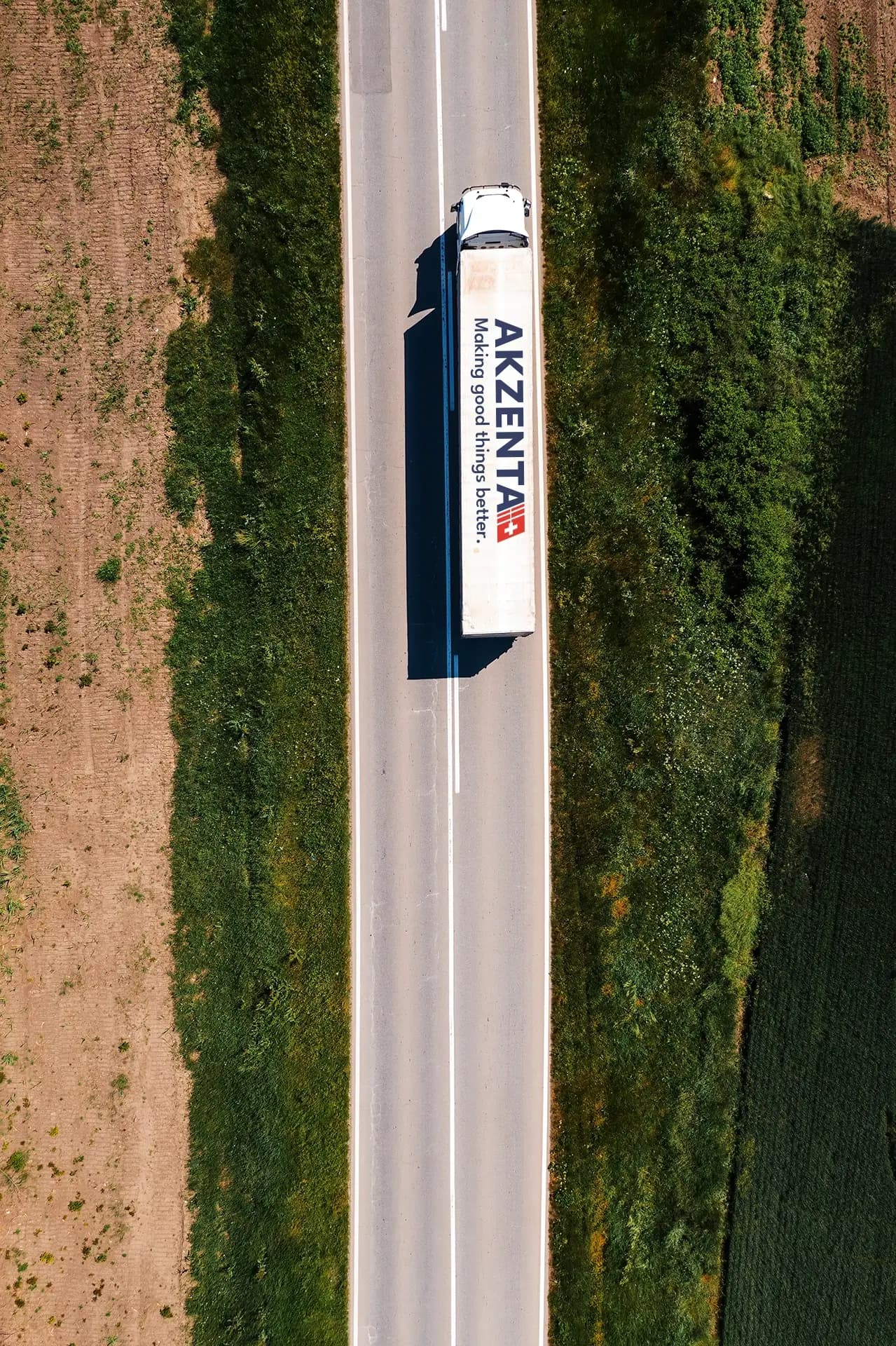 Akzenta branded transport vehicle on a road, highlighting the company's logistics and reliable delivery capabilities.