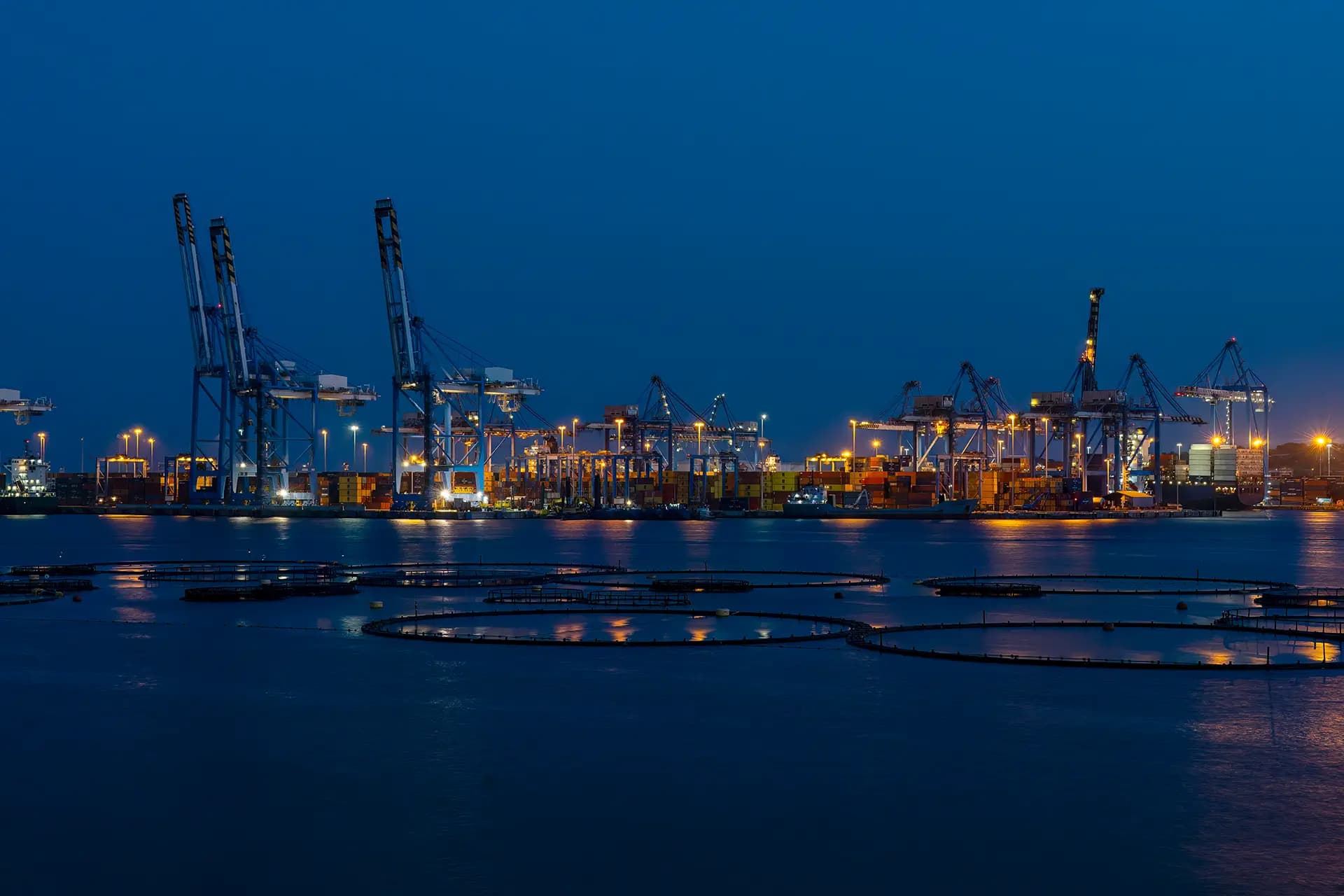 Night view of the Hamburg harbor, representing the city where Akzenta was founded in 1979.