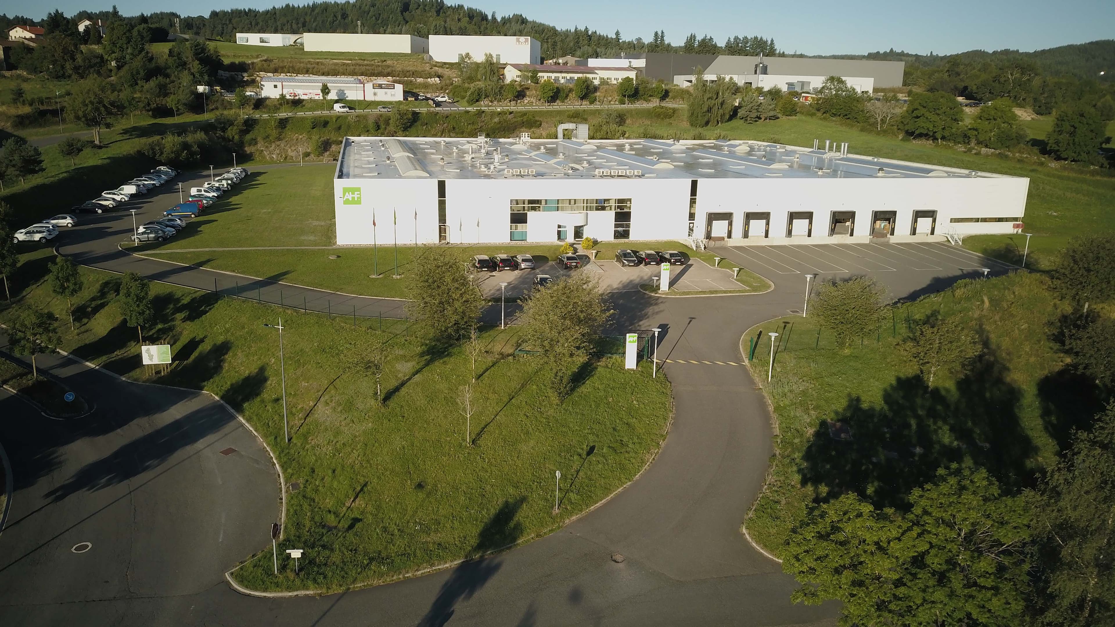 Aerial view of the AHF manufacturing facility in France, showcasing the company's production site and infrastructure.