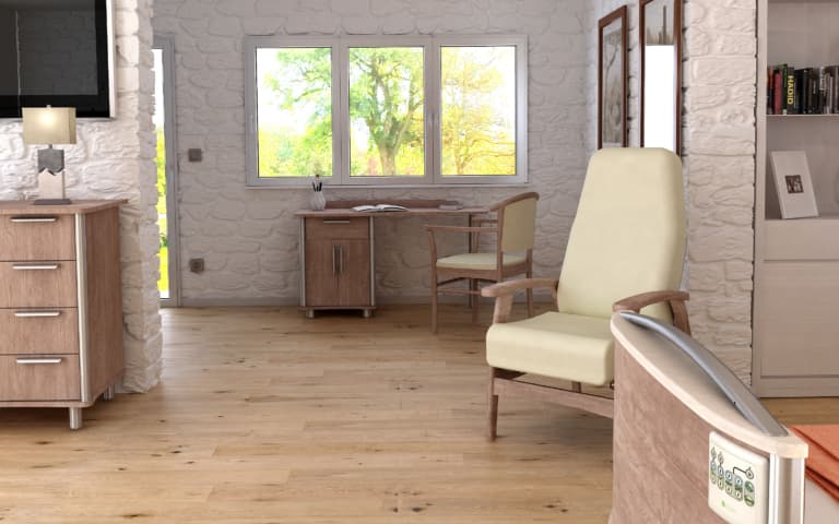 A furnished room with a wooden chair, desk, and medical bed frame, resembling a residential care facility or nursing home interior.