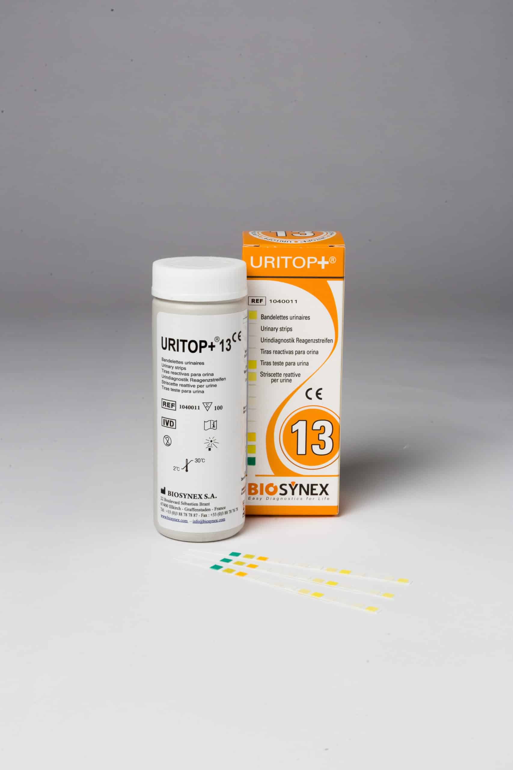 A single URITOP+ 13 urinary test kit consisting of a plastic reagent bottle, its cardboard packaging box, and three test strips.