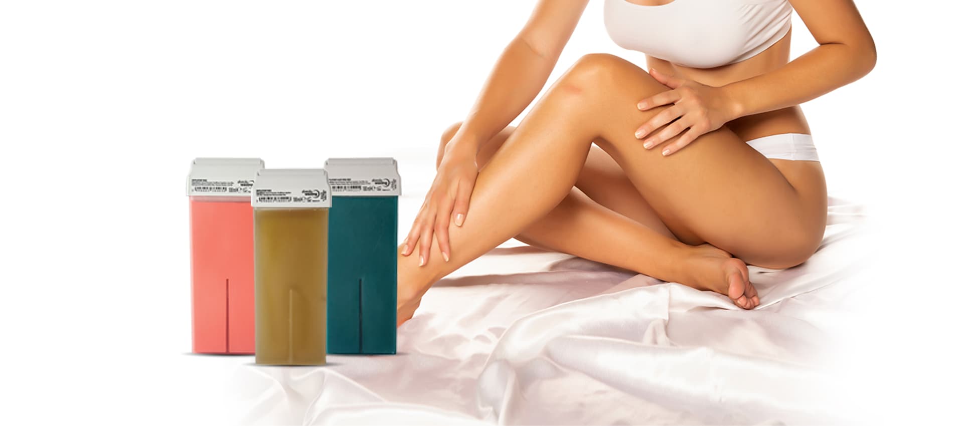 Three colored wax cartridges placed next to a woman sitting on a white sheet, representing cosmetic hair removal products.