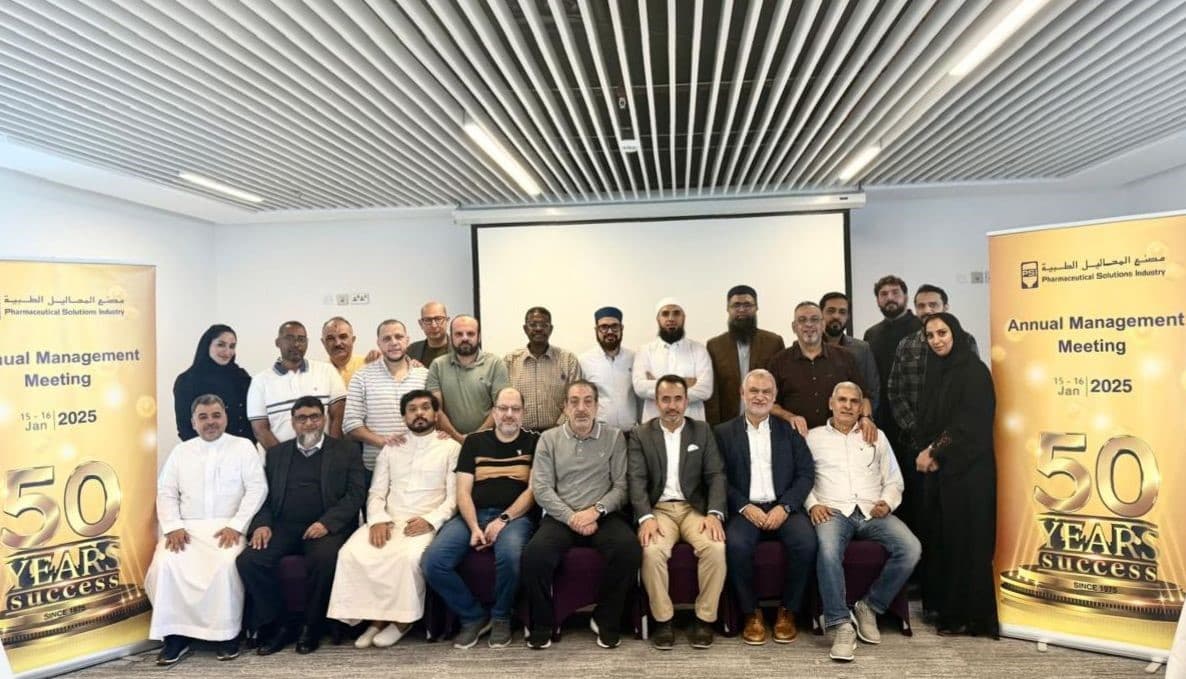 Group portrait of the company staff and management team during the 2025 annual management meeting.