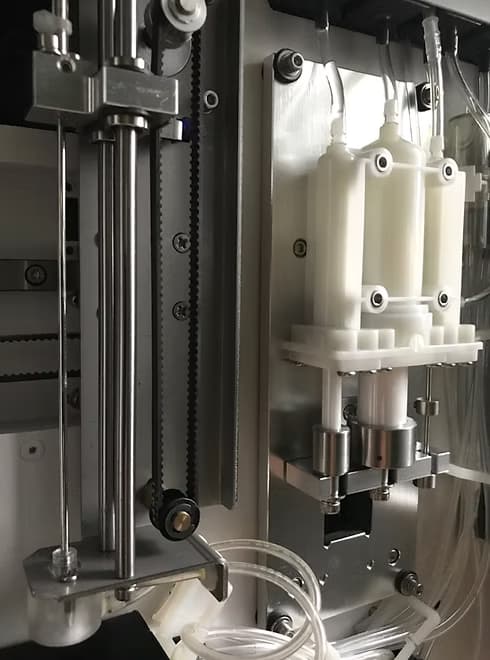 Internal mechanical components and fluidic systems of a hematology analyzer, showing precision engineering and manufacturing detail.