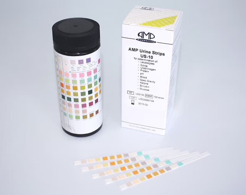 A kit containing a bottle of AMP urine test strips, the product packaging box, and several individual test strips laid out.
