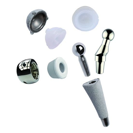 A collection of orthopedic joint replacement components, including metal stems, polished heads, and plastic inserts arranged on a white background.