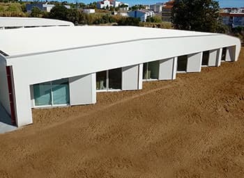 Exterior view of the modern biosurfit production facility, showcasing the architectural design of the manufacturing site.