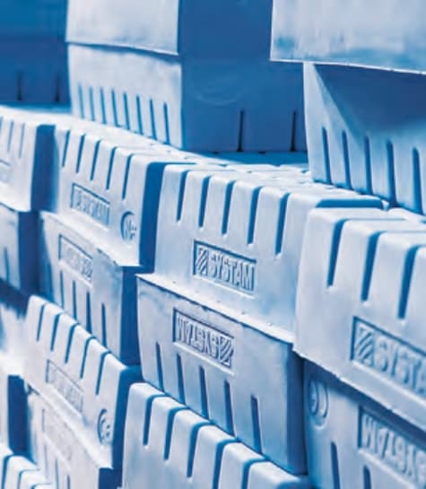 Stacked inventory of molded medical foam components ready for assembly or distribution.