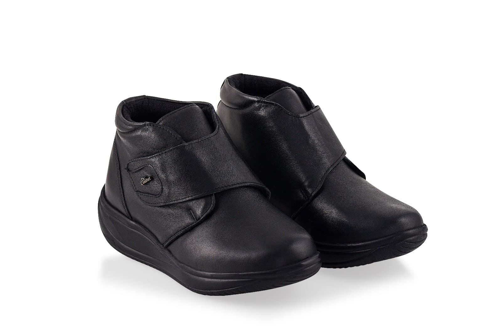 Pair of black orthopedic rocker bottom shoes shown on a clean white background.