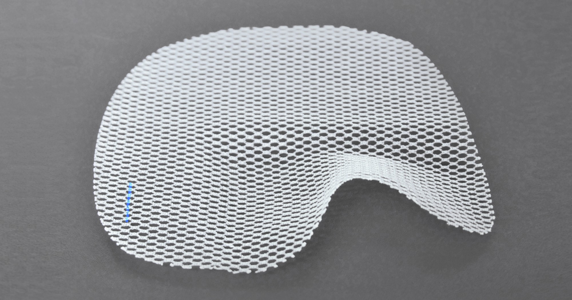 Alternative studio shot of the same 4DMESH product on a dark grey background, showing its texture and shape clearly.